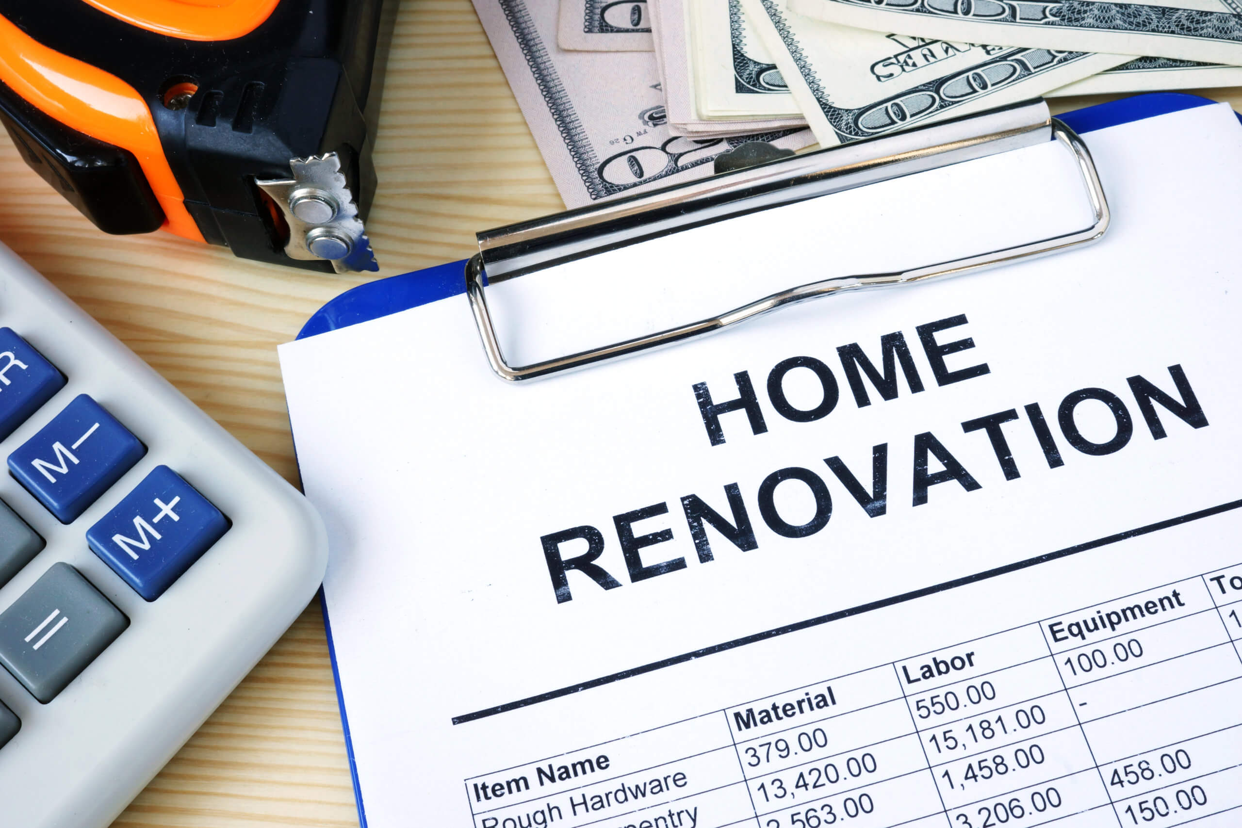 Clipboard with budget calculations about home renovation. Preventing Home Improvement Fraud